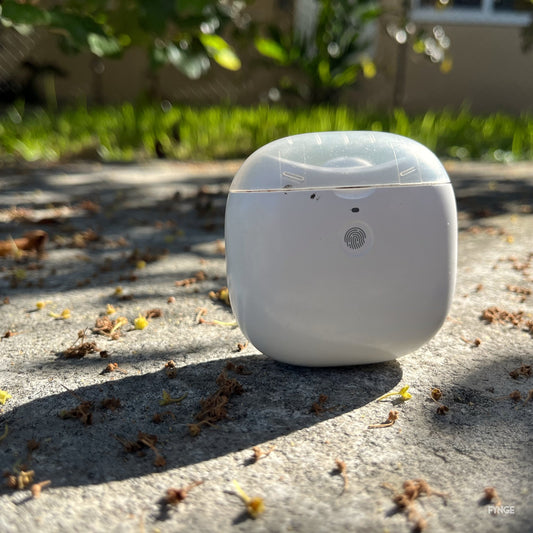 FYNGE electric nail trimmer standing on sunlit concrete