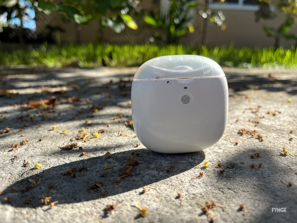 FYNGE electric nail trimmer standing on sunlit concrete, casting a soft shadow